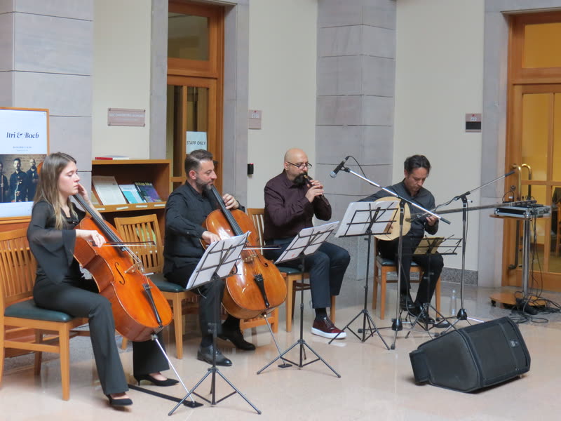 The quartet playing in a library hall